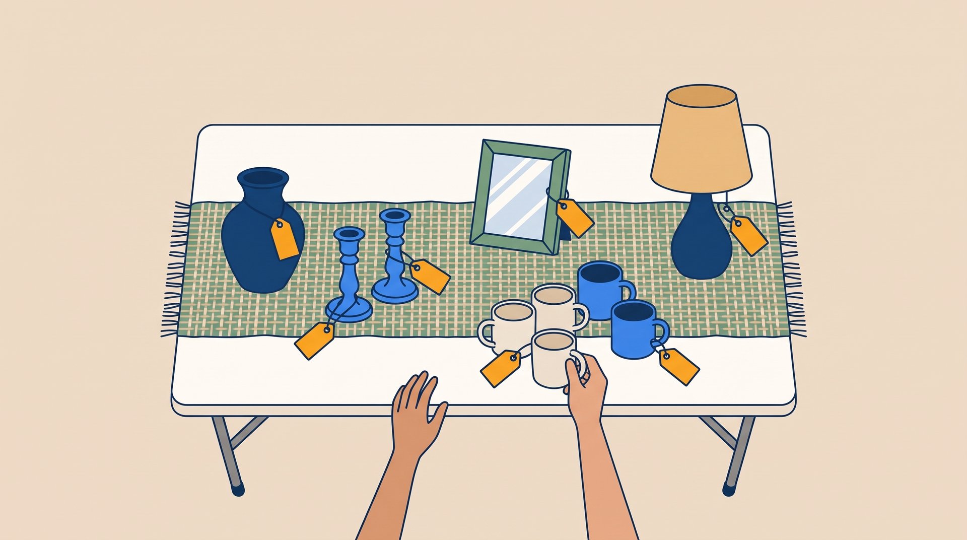 Seen from above, a garage sale table holds a vase, candle holders, a small mirror, mugs and a lamp, as a shopper reaches for a mug.